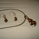 Clear glass genie bottle shaped necklace & earring set with gold and black swirls - eg10