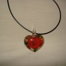Red rose in a clear puffy heart glass pendant - eg06