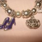 Silver stretch bracelet with enameled purse & shoe charms - eg23