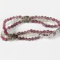 Light purple and light green multi strand bracelet
