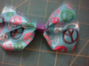 peace and purple bow clip