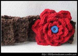 Crocheted headband with large red flower