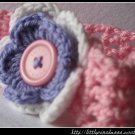 Crocheted headband with layered flower for baby
