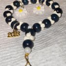 WHITE BLUE BRACELET WITH WHITE FLOWER CHARMS