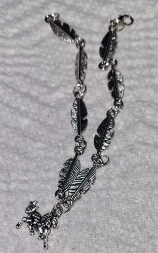 Feather Bracelet With Dangling Horse