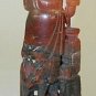 Oriental hard stone carving of man with fish
