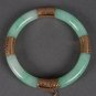 Certified Chinese jade bangle with hammered-gold mounts