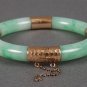 Certified Chinese jade bangle with hammered-gold mounts