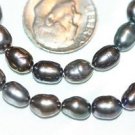 BLACK IRIDESCENT FRESHWATER PEARL BEADS -16 INCH STRAND