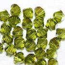 12 SWAROVSKI CRYSTAL OLIVINE- 4MM BICONE BEADS
