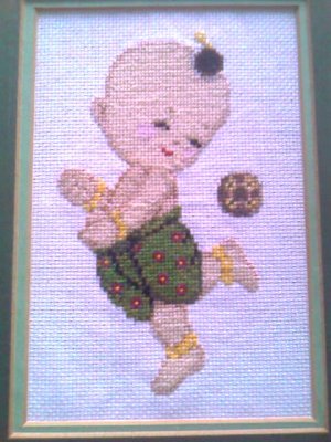 Thai kid with rattan ball