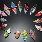 20 multi-colored origami cranes made with recycled paper