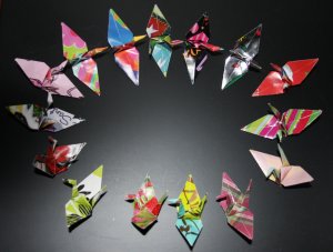 20 multi-colored origami cranes made with recycled paper