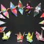 20 multi-colored origami cranes made with recycled paper
