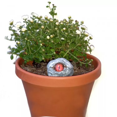 Creepy Rock Sculpture For Plants Red Glass Eyes Plant Watcher