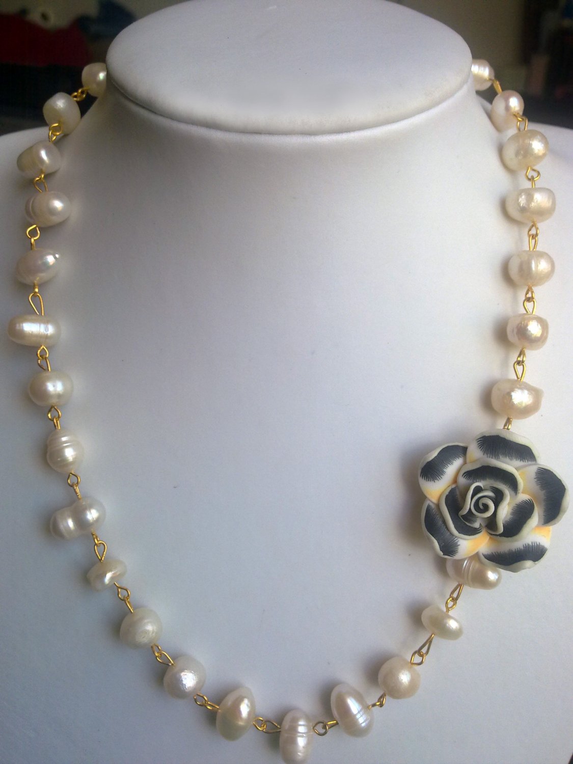 Strand of pearls and a flower