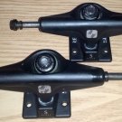 Silver S-class black skateboard trucks Low