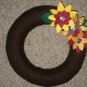 Hand made wreath with decorative flowers