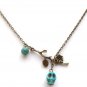 Antiqued Brass Branch Turquoise Skull Necklace