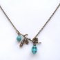 Antiqued Brass Branch Turquoise Skull Necklace