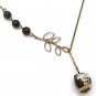 Antiqued Brass Leaf Black Agate Porcelain Owl Necklace