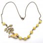 Antiqued Brass Leaf Lemon Jade Porcelain Giraffe Necklace