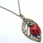 Antiqued Brass Leaf Porcelain Ladybug NecklaceFrom gemandmetal