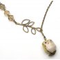 Antiqued Brass Leaf Quartz Porcelain Owl Necklace