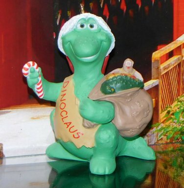 1991 Hallmark Keepsake Ornament Dinoclaus with sack of Presents prehistoric