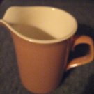 Tan Pitcher