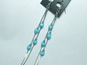 Silver tone earring with blue dangle bead