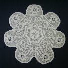 Hand crocheted ecru rainbow star doily.