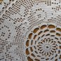 Round white doily garland of roses