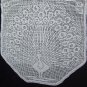 White handmade crocheted tablecloth with peacocks