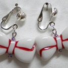 White bow w/red line clip on earring