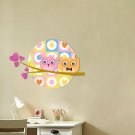 Kids vinyl wall decal of 2 owls on a tree branch with the moon
