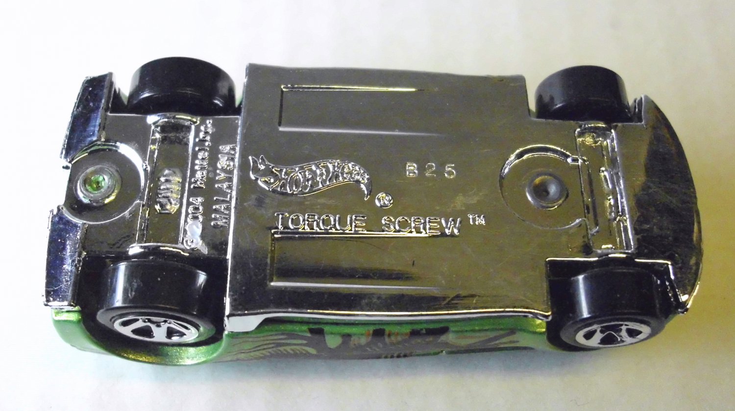 Torque Screw, Hot Wheels metallic lime green die cast car with Dinosaur decals, 2004, Hotwheels.