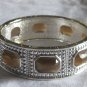 Silver with brown stones