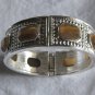 Silver with brown stones