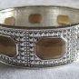 Silver with brown stones