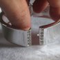silver cuff with rhinestones
