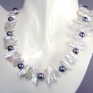 white biwa and black pearl necklace