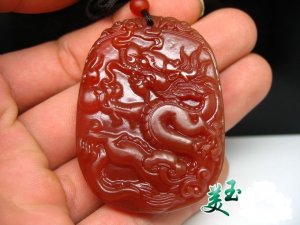 Excellent natural red agate pendant. Dragon world. Hand-carved