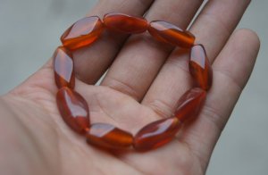 Hand-carved,; multi-faceted red agate bracelet, nine beads. Natural quality agate bracelet.