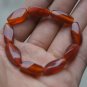 Hand-carved,; multi-faceted red agate bracelet, nine beads. Natural quality agate bracelet.