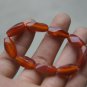 Hand-carved,; multi-faceted red agate bracelet, nine beads. Natural quality agate bracelet.