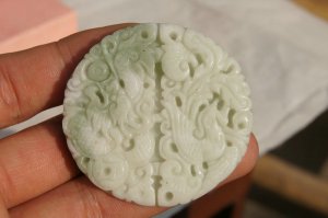 Natural jade pendant. Hand-carved dragon and phoenix. Auspicious white jade pendant