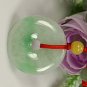 Floating emerald green peace buckle. Pendant. Good luck pendant.