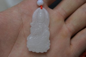 Guanyin Buddha. Hand-carved white jade Guanyin pendant about 42x20mm.