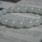 Natural white onyx. Hand-carved. 18 drums beads. The rubber band strung together.
